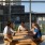 Friends gathering, sitting at large table