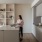 woman standing at kitchen island