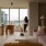 woman leaning on wall in living room