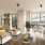 Spacious living room at Kaye Belltown luxury apartment in Seattle with floor-to-ceiling windows and skyline views