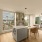 Luxury apartment kitchen with quartz countertops, stainless steel appliances, and custom cabinetry at Kaye Belltown